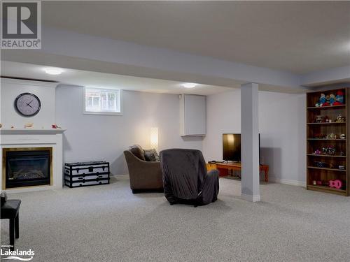 Large Rec Room with Gas Fireplace - in-law potential - 1 Kirbys Way, Huntsville, ON - Indoor Photo Showing Basement With Fireplace