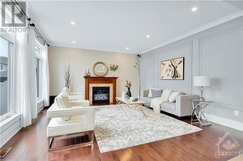 100 Brambling Way, Ottawa, ON - Indoor Photo Showing Living Room With Fireplace