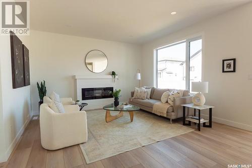 211 Flynn Bend, Saskatoon, SK - Indoor Photo Showing Living Room With Fireplace