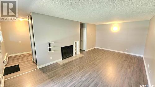 105 39 Rodenbush Drive, Regina, SK - Indoor Photo Showing Other Room With Fireplace