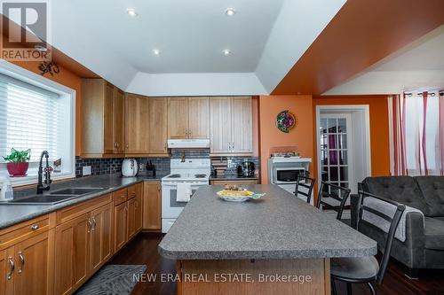348 Elgin Street W, Cobourg, ON - Indoor Photo Showing Kitchen With Fireplace With Double Sink