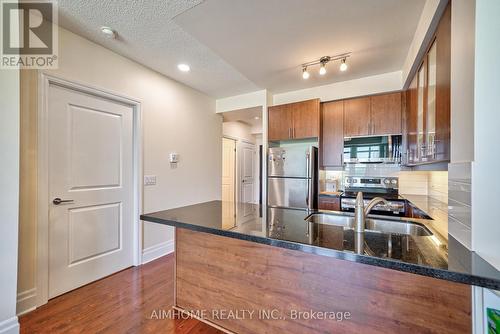 411 - 111 Upper Duke Crescent, Markham, ON - Indoor Photo Showing Kitchen With Double Sink