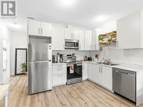 102 Leota Street, Whitehorse, YT - Indoor Photo Showing Kitchen With Double Sink