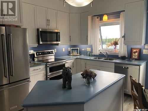 13 Jensen Bay - Blue Heron Ridge, Fish Lake, SK - Indoor Photo Showing Kitchen With Double Sink