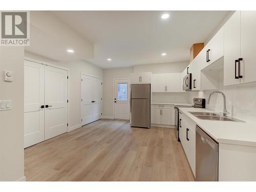 1229 Lone Pine Drive, Kelowna, BC - Indoor Photo Showing Kitchen With Double Sink