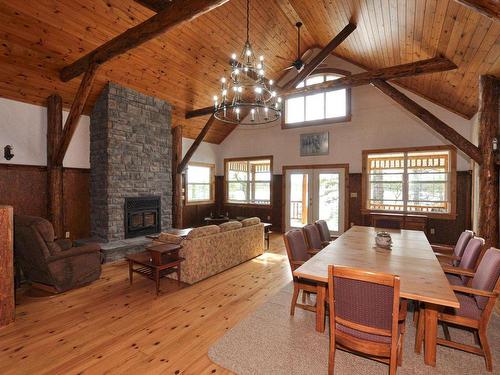 27 Little Sand Lake, District Of Kenora, ON - Indoor Photo Showing Dining Room With Fireplace