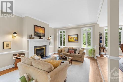 1323 Scharfgate Drive, Ottawa, ON - Indoor Photo Showing Living Room With Fireplace
