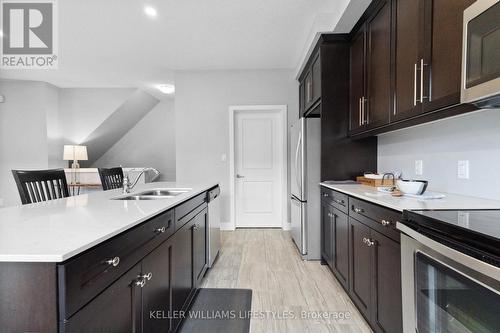 104 - 1960 Dalmagarry Road, London, ON - Indoor Photo Showing Kitchen With Double Sink