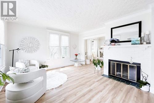 1105 Queen St E, Sault Ste. Marie, ON - Indoor Photo Showing Living Room With Fireplace