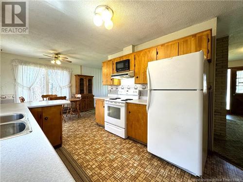 23 Maple Court, Saint Andrews, NB - Indoor Photo Showing Kitchen With Double Sink