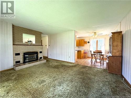 23 Maple Court, Saint Andrews, NB - Indoor Photo Showing Living Room With Fireplace