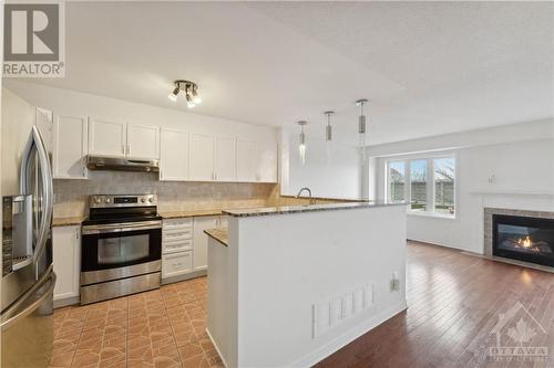 220 Macoun Circle, Ottawa, ON - Indoor Photo Showing Kitchen With Fireplace