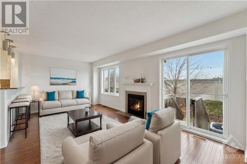virtually staged - 220 Macoun Circle, Ottawa, ON - Indoor Photo Showing Living Room With Fireplace