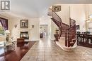 Circular showpiece staircase. - 2159 Blue Willow Crescent, Ottawa, ON  - Indoor With Fireplace 