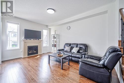 23 Auckland Drive, Whitby, ON - Indoor Photo Showing Living Room With Fireplace