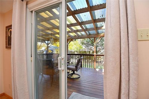 Patio doors leading off dining area to private covered deck - 110 Highbury Drive, Stoney Creek, ON - Indoor Photo Showing Other Room