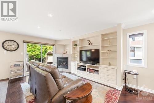 8 Randall James Drive, Ottawa, ON - Indoor Photo Showing Living Room With Fireplace