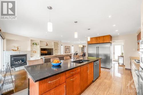 8 Randall James Drive, Ottawa, ON - Indoor Photo Showing Kitchen With Fireplace With Upgraded Kitchen