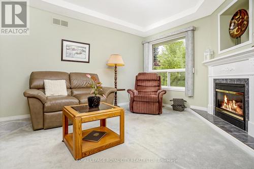 117 Lou'S Boulevard, Guelph/Eramosa, ON - Indoor Photo Showing Living Room With Fireplace