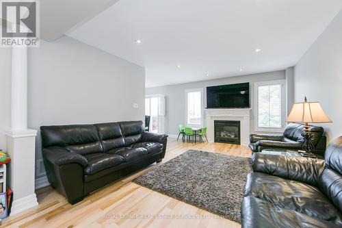 1089 Knotty Pine Grove, Mississauga, ON - Indoor Photo Showing Living Room With Fireplace