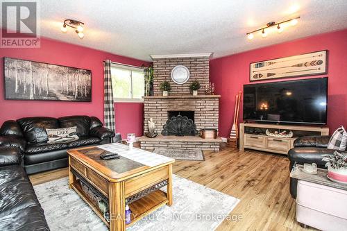 99 Pontypool Road, Kawartha Lakes, ON - Indoor Photo Showing Living Room With Fireplace