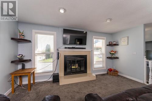 7541 St Patrick Avenue, Prince George, BC - Indoor Photo Showing Living Room With Fireplace