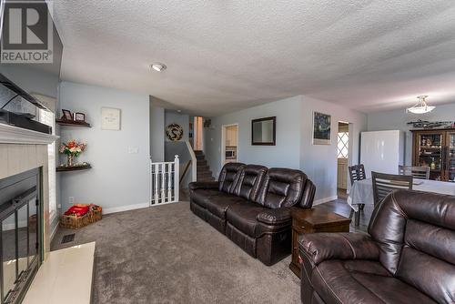7541 St Patrick Avenue, Prince George, BC - Indoor Photo Showing Living Room With Fireplace