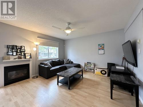 106 2423 8Th Avenue, Prince George, BC - Indoor Photo Showing Living Room With Fireplace