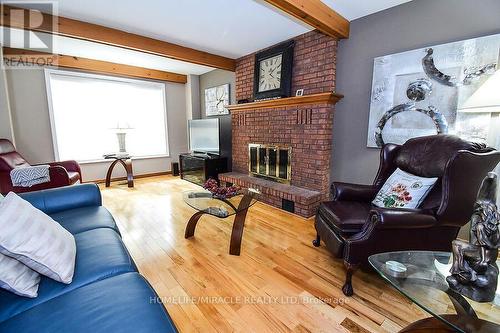 3 Barbican Trail, St. Catharines, ON - Indoor Photo Showing Living Room With Fireplace
