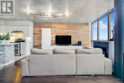 725 - 250 Manitoba Street, Toronto, ON - Indoor Photo Showing Living Room With Fireplace