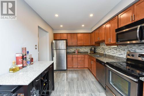 27 - 750 Burnhamthorpe Road E, Mississauga, ON - Indoor Photo Showing Kitchen With Stainless Steel Kitchen With Double Sink