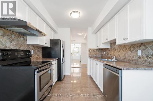 210 - 1 Emerald Lane, Vaughan, ON - Indoor Photo Showing Kitchen With Stainless Steel Kitchen