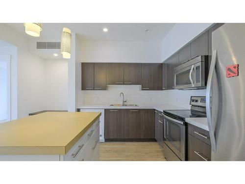 101-985 Academy Way, Kelowna, BC - Indoor Photo Showing Kitchen With Double Sink