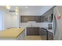 101-985 Academy Way, Kelowna, BC  - Indoor Photo Showing Kitchen With Double Sink 