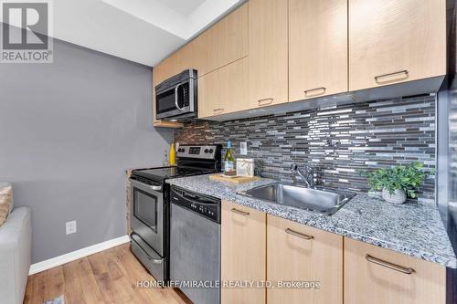 1110 - 38 Joe Shuster Way, Toronto, ON - Indoor Photo Showing Kitchen With Upgraded Kitchen