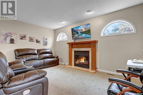 1102 Wascana Highlands, Regina, SK - Indoor Photo Showing Living Room With Fireplace