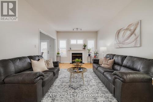4 - 545 Laurelwood Drive, Waterloo, ON - Indoor Photo Showing Living Room With Fireplace