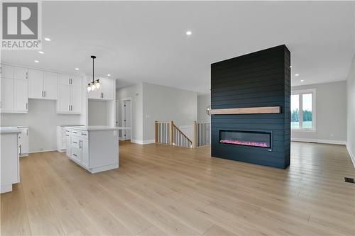 3773 River Road, Renfrew, ON - Indoor Photo Showing Kitchen With Fireplace