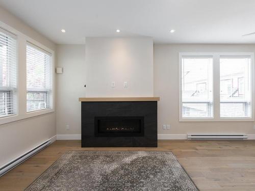 204-9710 Fourth St, Sidney, BC - Indoor Photo Showing Living Room With Fireplace