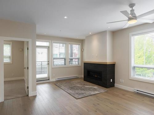 204-9710 Fourth St, Sidney, BC - Indoor Photo Showing Living Room With Fireplace