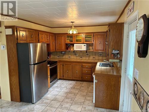 100 Brent Lane, Dalhousie, NB - Indoor Photo Showing Kitchen With Double Sink