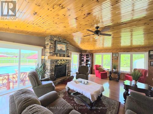 288 White Water Road, Pembroke, ON - Indoor Photo Showing Living Room With Fireplace