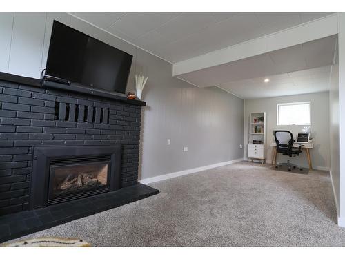 239 107Th Avenue, Kimberley, BC - Indoor Photo Showing Living Room With Fireplace