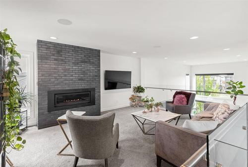 29 East Plains Drive, Winnipeg, MB - Indoor Photo Showing Living Room With Fireplace
