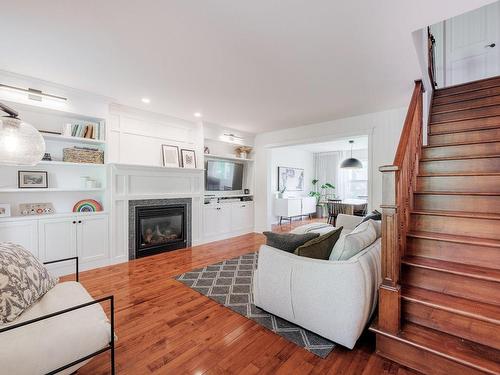 Staircase - 152 Av. Jacques-Martin, La Prairie, QC - Indoor Photo Showing Living Room With Fireplace