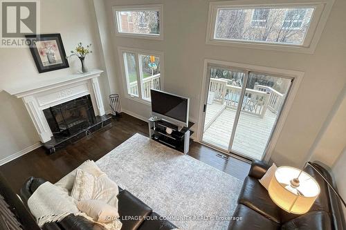 56 Carnival Court, Toronto, ON - Indoor Photo Showing Living Room With Fireplace