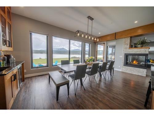 1574 Koocanusa Lake Drive, Lake Koocanusa, BC - Indoor Photo Showing Dining Room With Fireplace