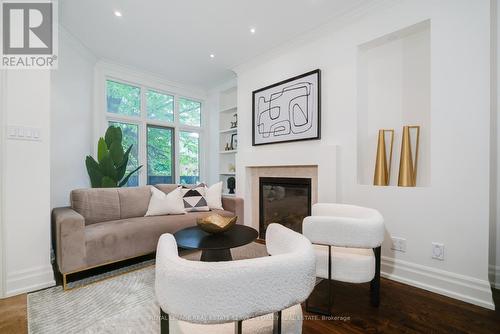 24 Alex Mews, Toronto, ON - Indoor Photo Showing Living Room With Fireplace