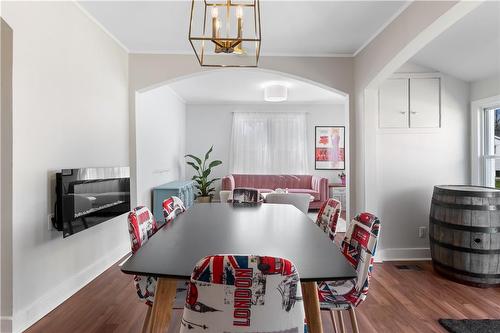 Dining area with ambiance of electric fireplace (staged) - 48 Belvidere Road, Crystal Beach, ON - Indoor Photo Showing Dining Room