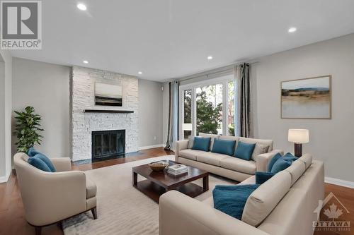 This image is virtually staged. - 3377 Mccarthy Road, Ottawa, ON - Indoor Photo Showing Living Room With Fireplace